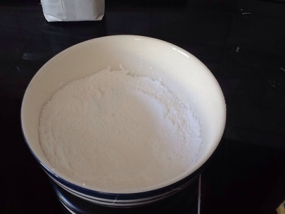 While letting the cake cool begin on the icing by adding 200 grams of icing sugar into a bowl