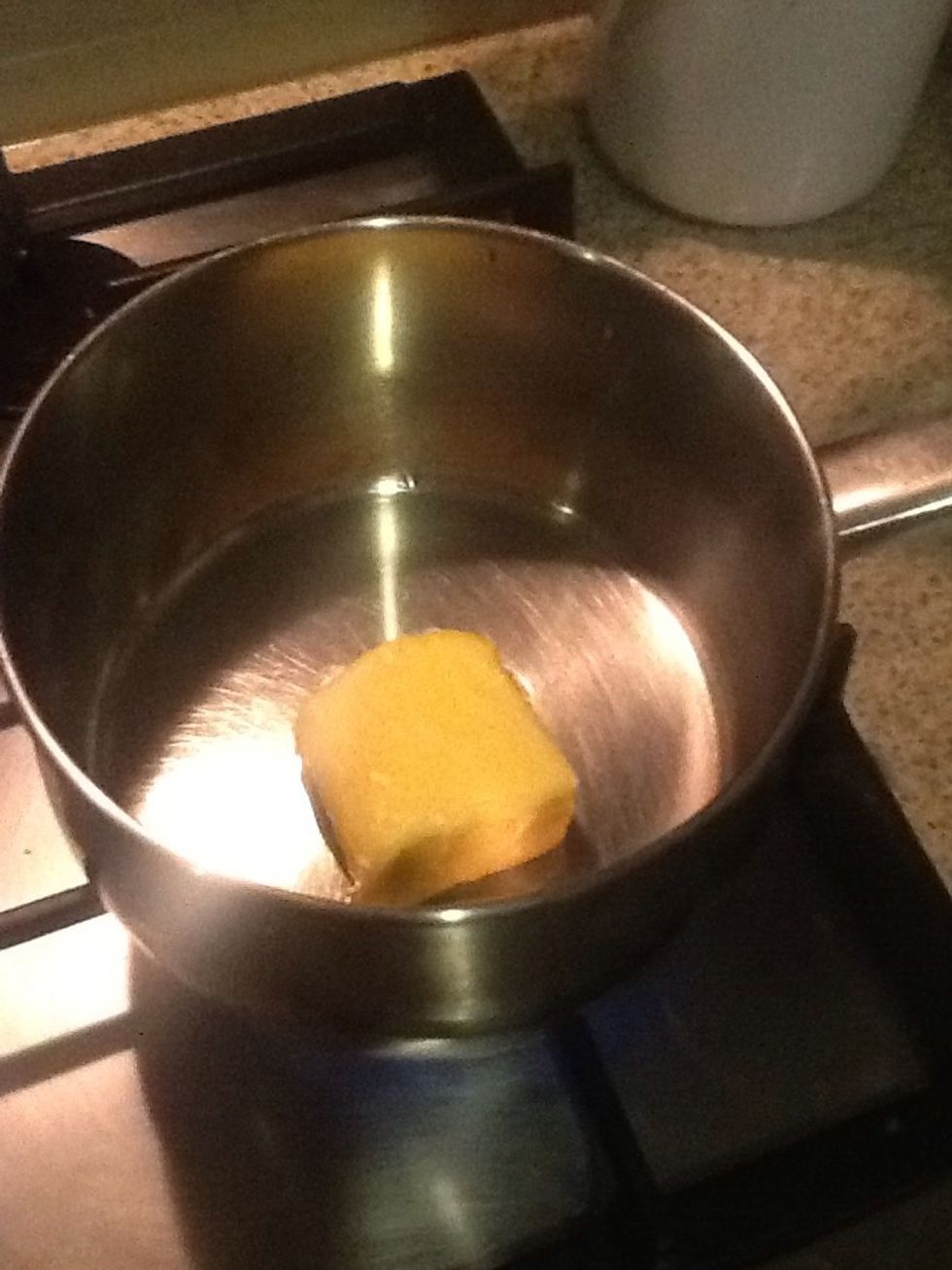 While macaroni is cooking, melt butter in a saucepan