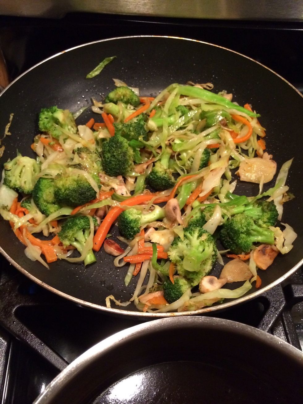 While my chicken was browning, I decided to chop up some of my families fav. veggies and stir fry them. YUM