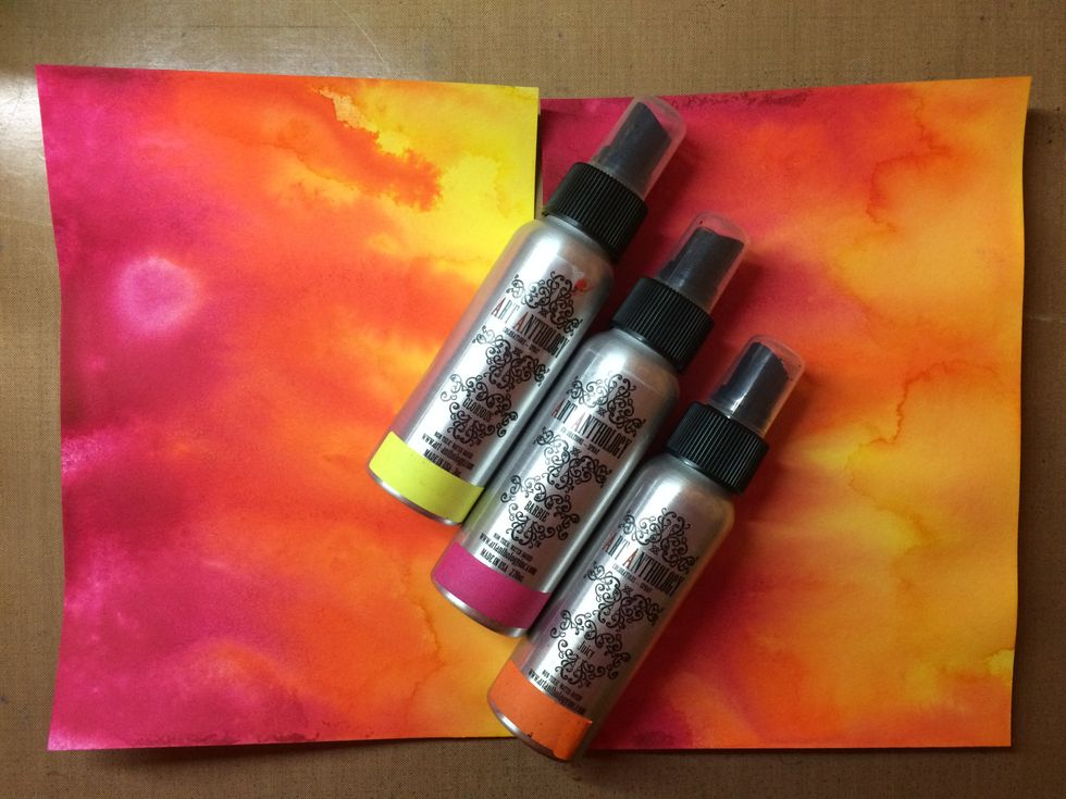 While my tags were drying I sprayed some watercolor paper with 3 colorations color sprays: Juicy, Glorious and Barbie.