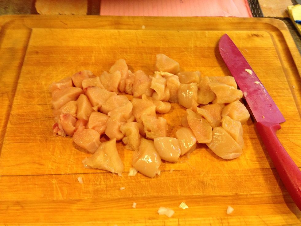 While onions are saut\u00e9ing dice up chicken into chunks