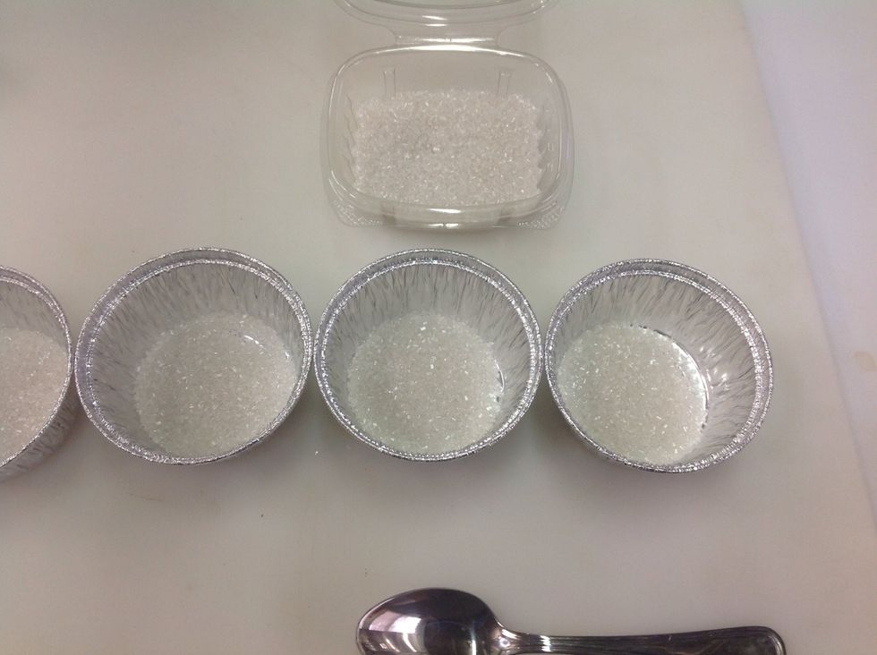 While oven is preheating, add a TSP of coarse sugar to ramekin or aluminum pans