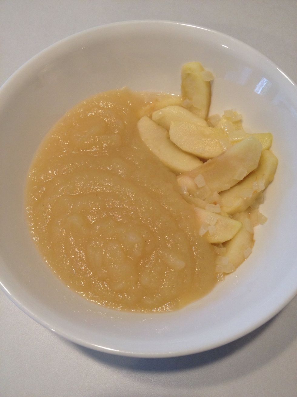 While pork chops are cooking, return to apple and onion bowl. Add applesauce.