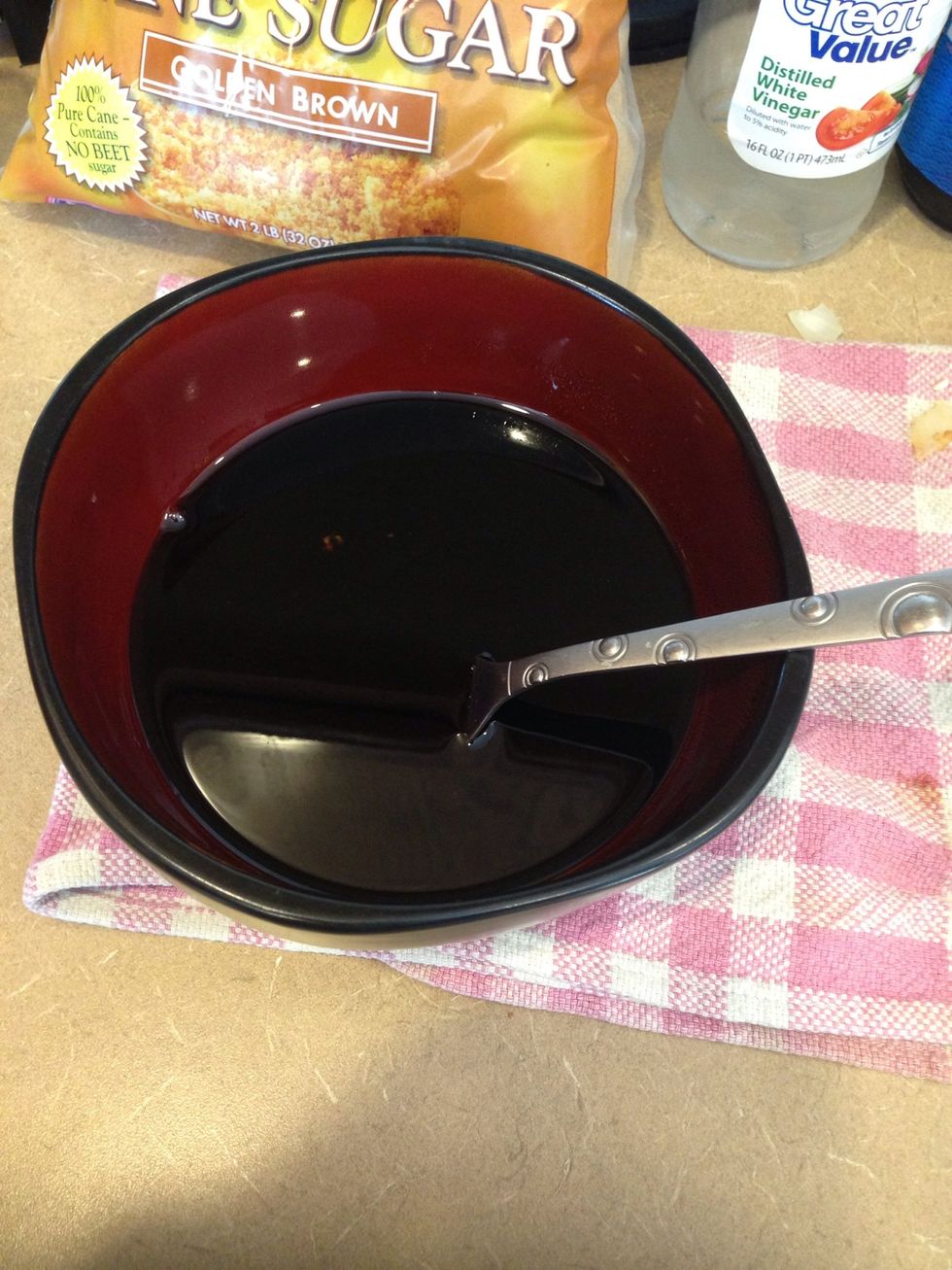 While pork is cooking, mix the soy sauce, vinegar and brown sugar together in a bowl. Set aside.