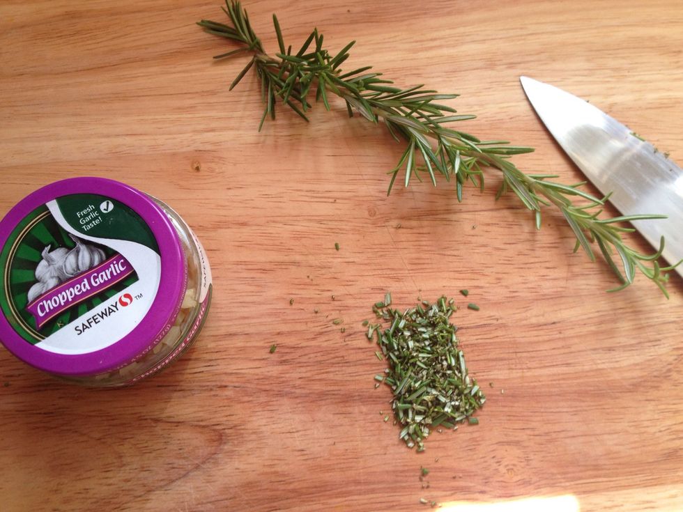 While potatoes boil, cut rosemary and garlic. Bunch the rosemary best you can, then cut into small pieces. I got precut garlic cause I'm lazy :)