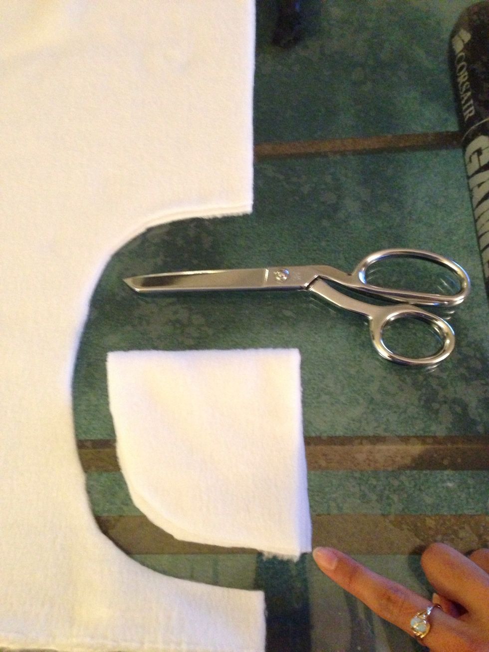 While someone is putting on the hoodie, take the white fold & cut out a 7in wide mouth (2 piece) again i did the curve by eye. To have the same curve on the otherwise, I folded it and then cut it out