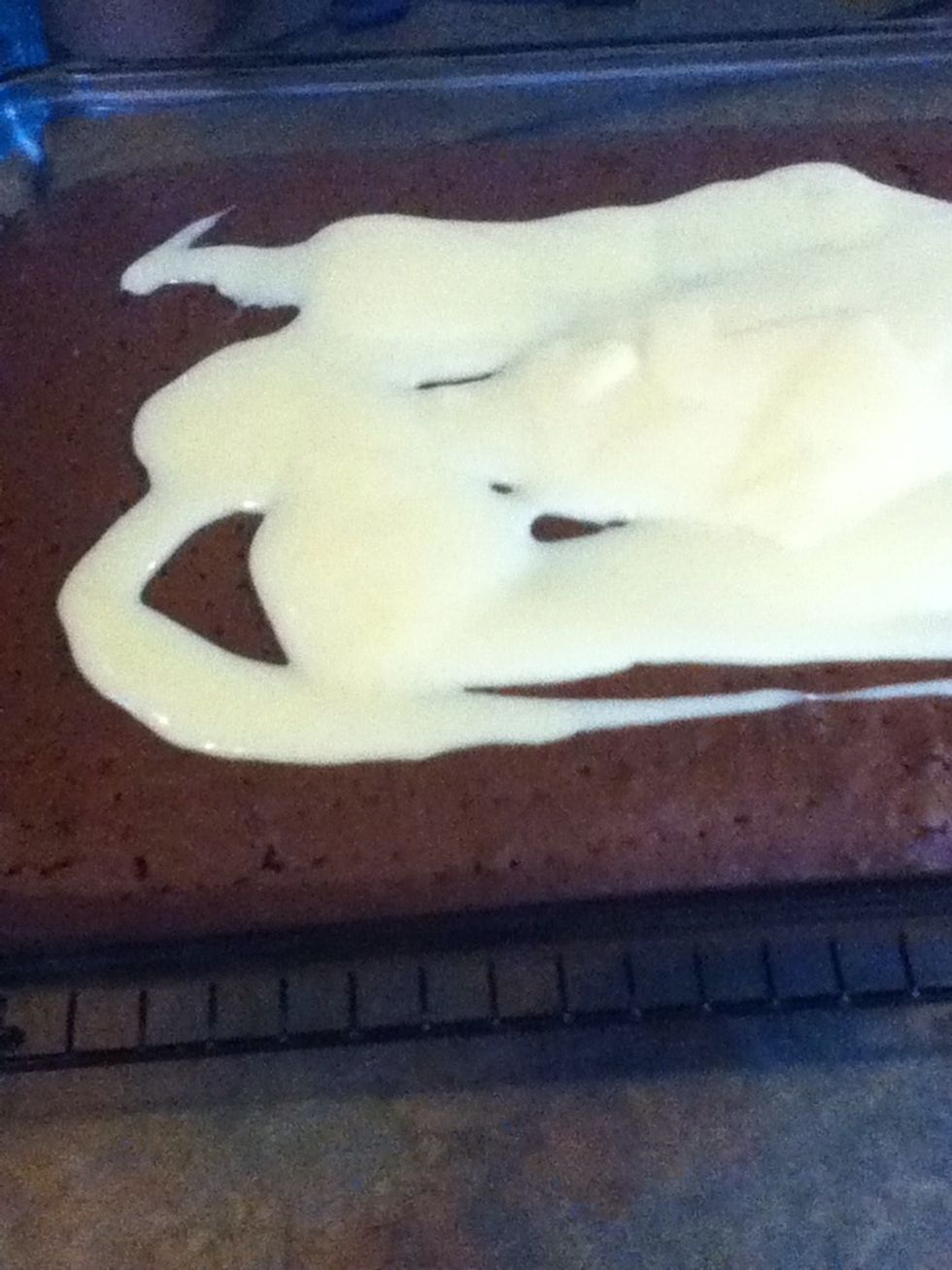 While still hot pour the sweetened condensed milk on the top of the cake. (Most of it will soak into the cake because of the holes)