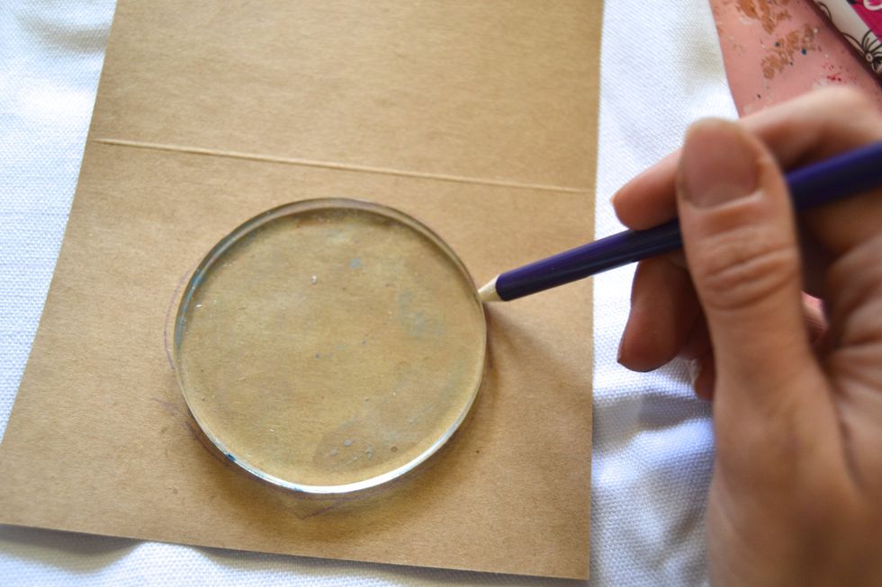 While that dries, grab a scrap of paper and trace your circle gel plate on to it. We are going to use this to make a template for our Tic Tac Toe Board.