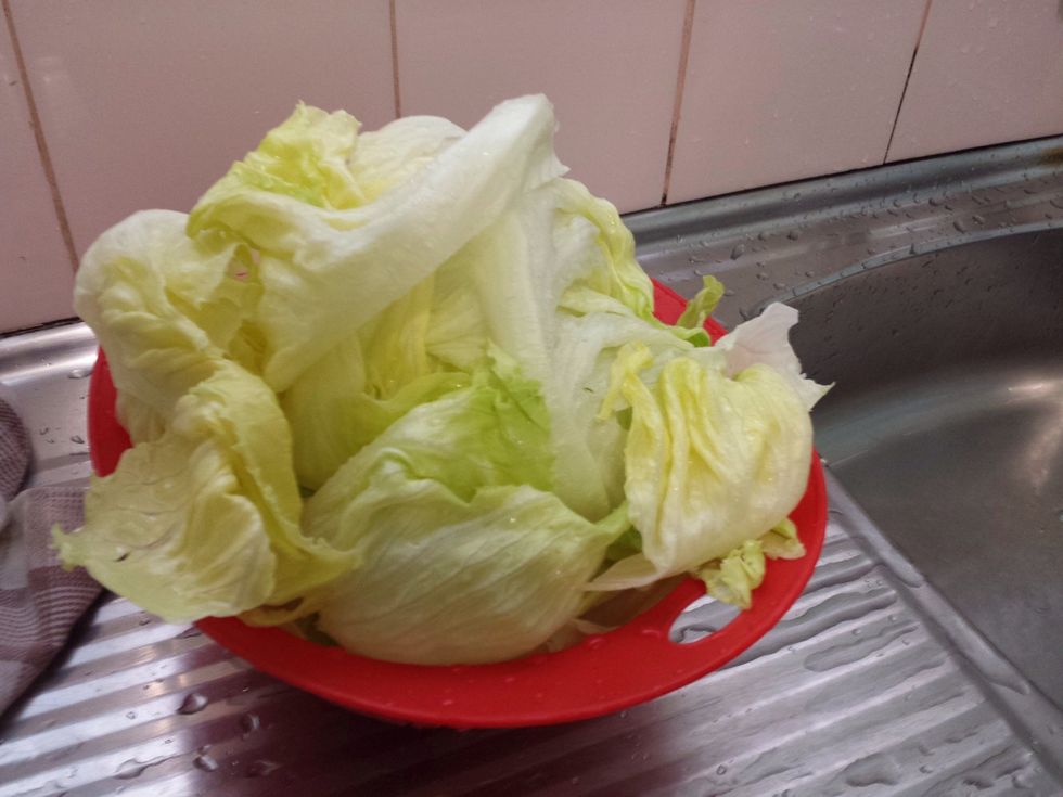 While that is cooking, quickly wash and peel the lettuce. Put it in a colander to drain.