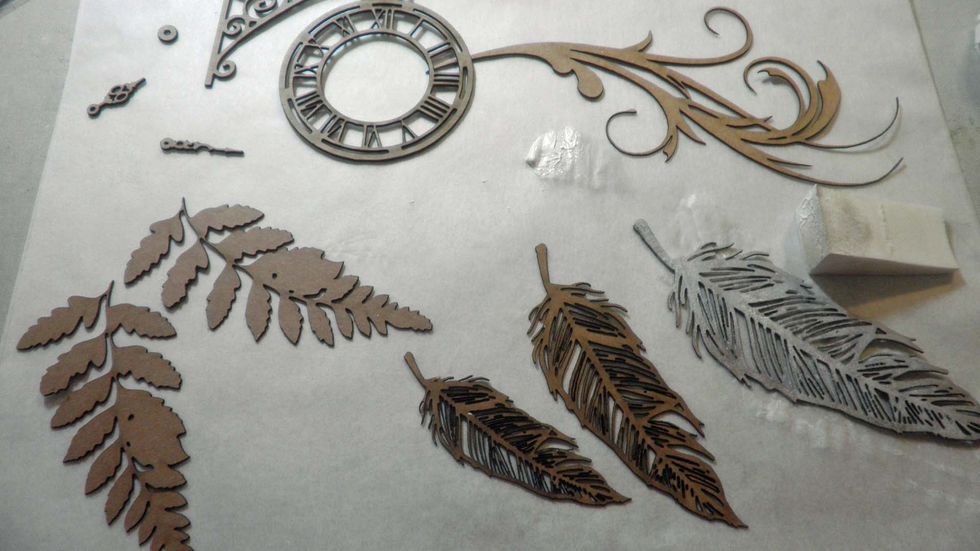 While that is drying, I chose some chipboard pieces from http://www.ginasdesigns.net and added white gesso to each with a makeup sponge.