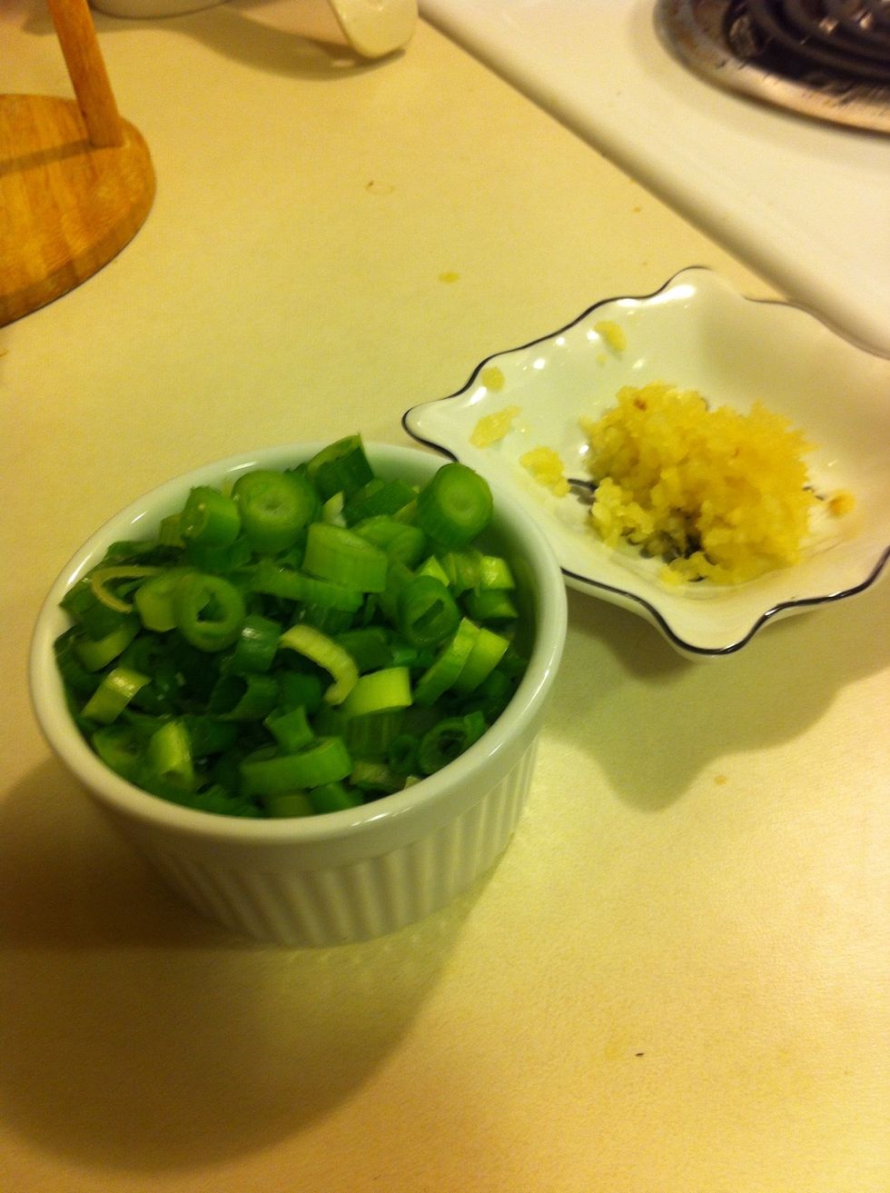 While that's cooking, press garlic and dice green onion!