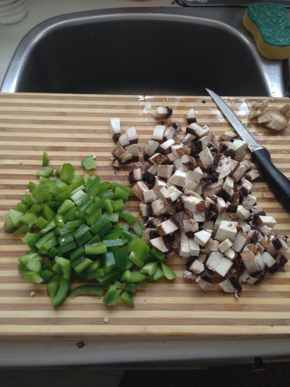 While that's heating, chop your desired veggies. I used green pepper and portobello mushrooms. You can add onions, different color peppers and whatever else you think would be tastey!