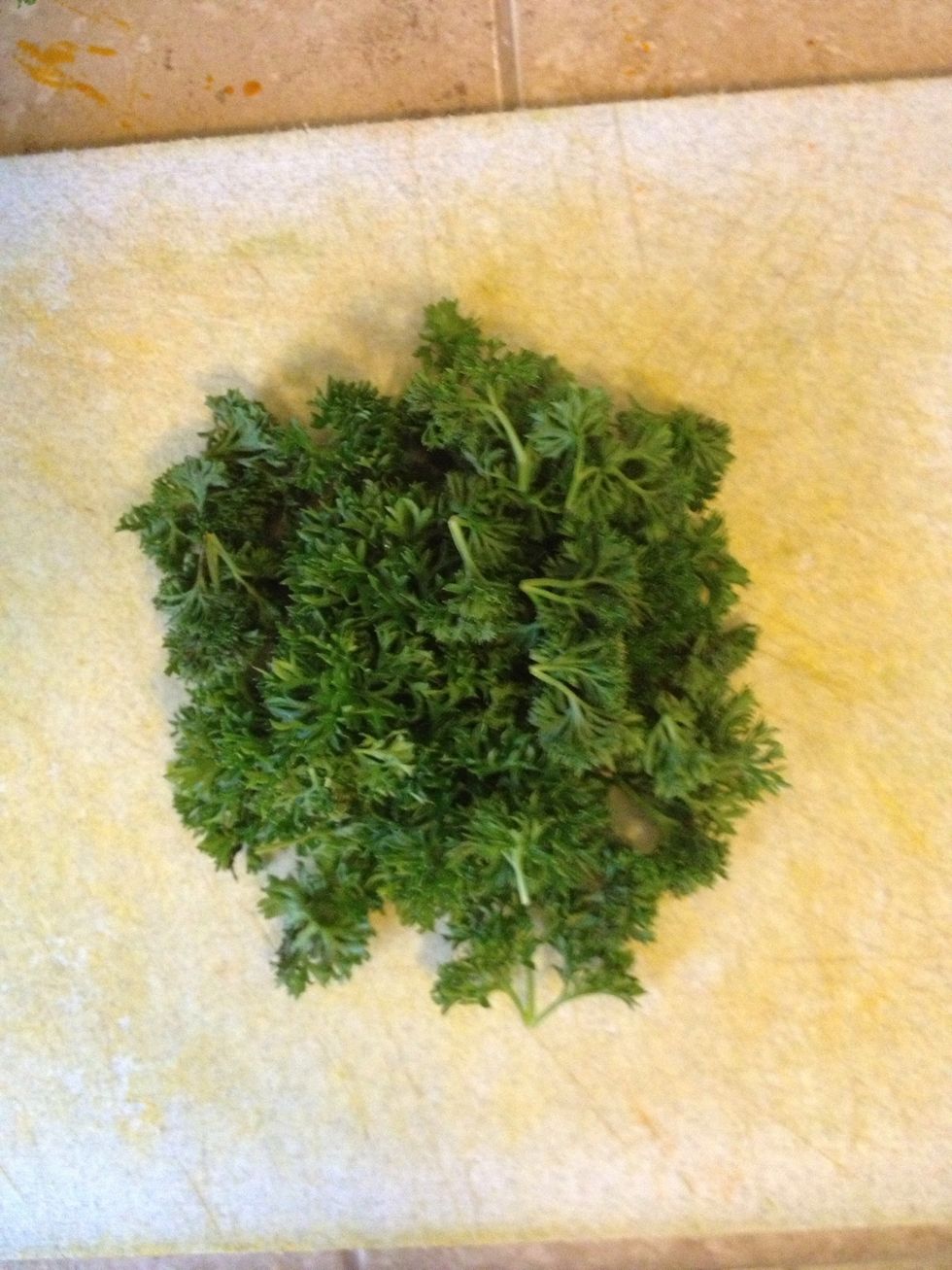 While that's simmering. Chop parsley.