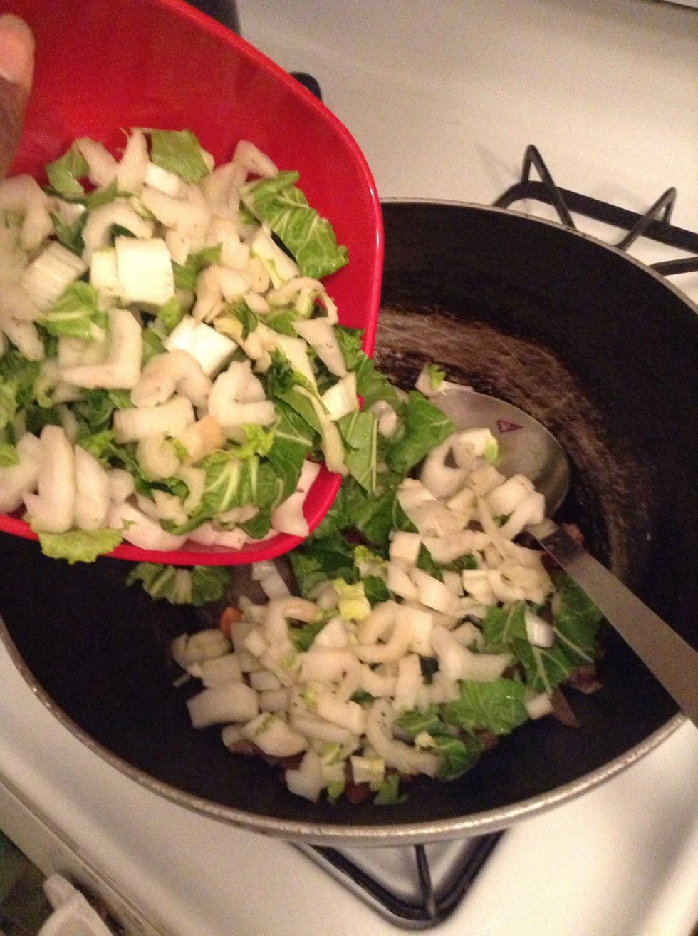 While the baked beans are heating up , put your Bok choy in the saucepan with the onions