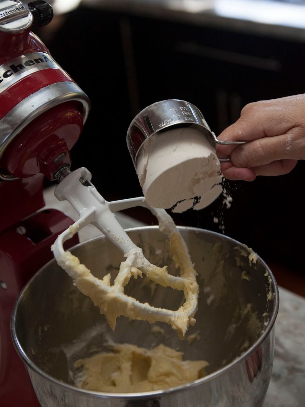 While the beaters on low, add the Flour, a half cup at a time.