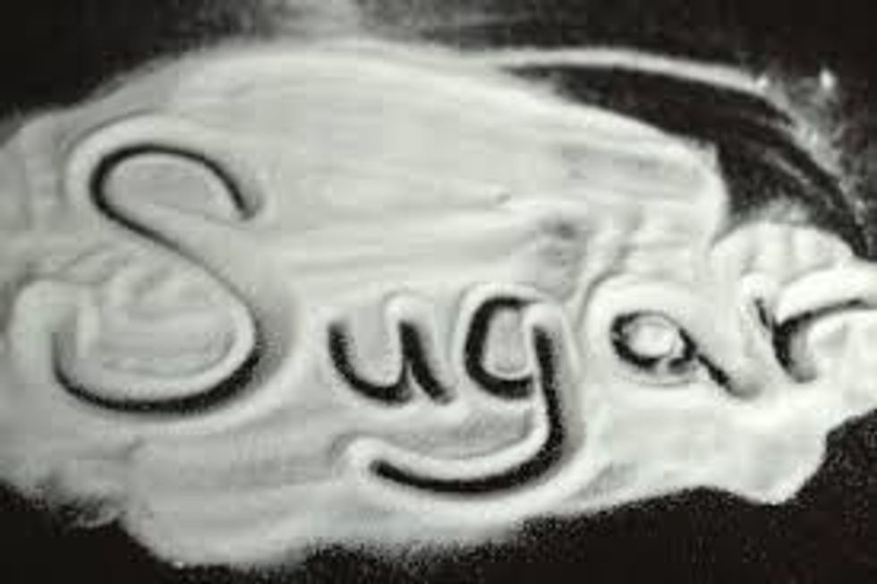 WHILE THE BREAD IS IN PAN SPRINKLE SUGAR ON ONE SIDE AND DO THE SAME WHEN YOU FLIP THE BREAD OVER.