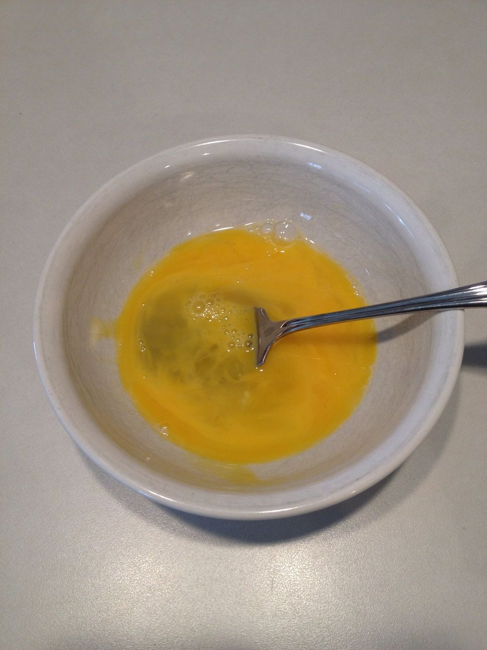 While the broccoli cooks, lightly beat your egg.