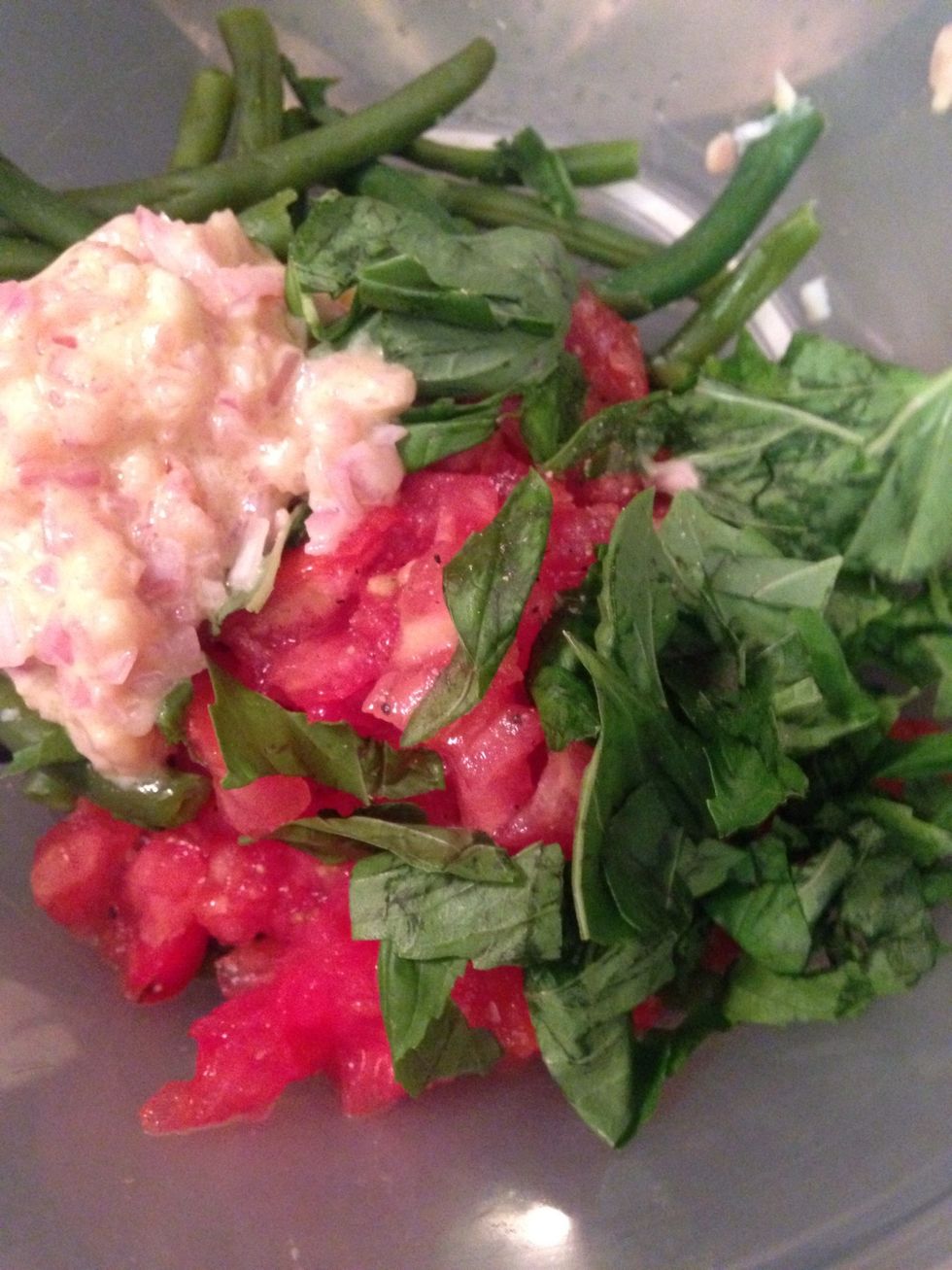 While the burgers continue add the diced tomato to the blanched beans and half the basil - add the vinaigrette