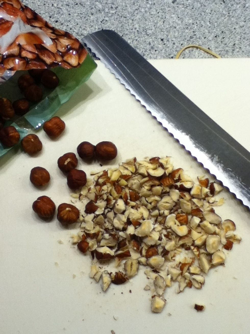 While the cake is baking, chop some nuts and dry them in the oven for about 5-10 minutes until they are golden