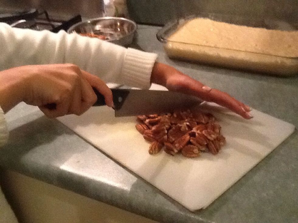 While the cake is baking, get the topping ready (use a chopping board and clean knife)