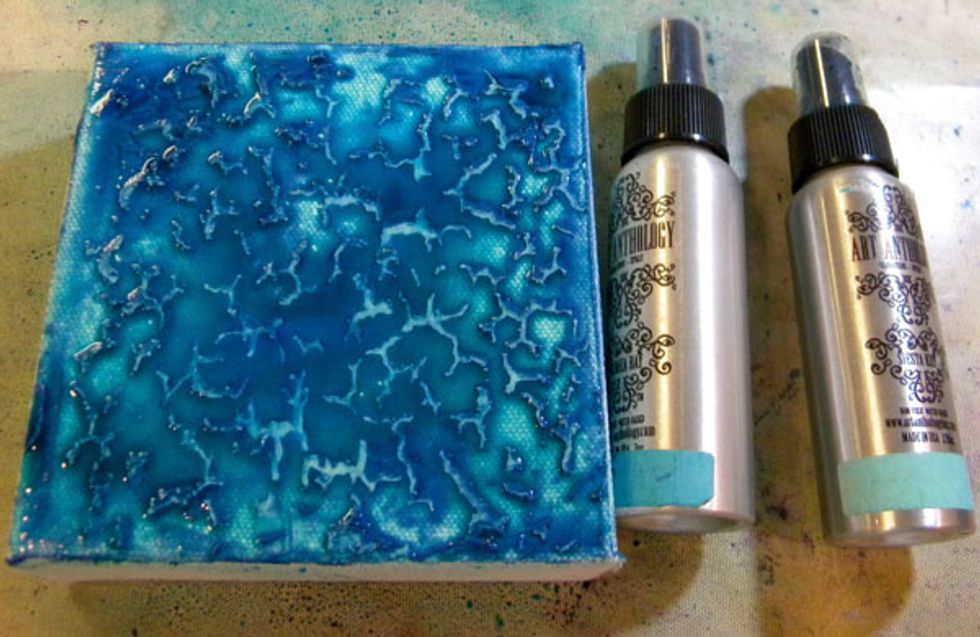 While the canvas is still wet, spray Waimea Bay Colorations Spray and let it pool in the crevices.  Let everything dry.  Art Anthology mediums are made for layering.