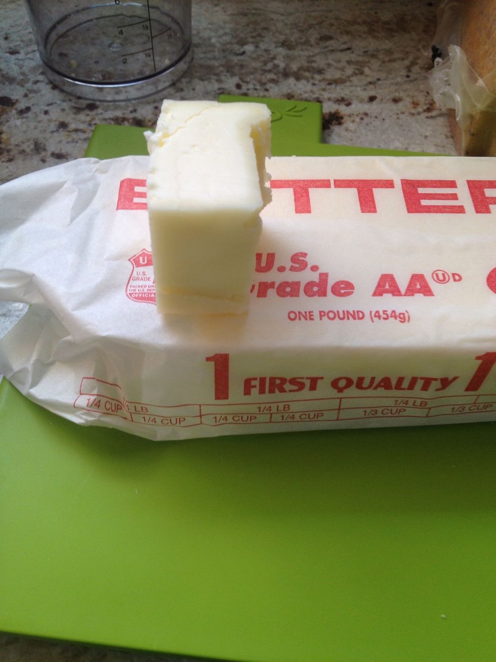 While the cheese starts to heat up, slice off a 1/4 cup chunk of butter. You can use more or less depending on how buttery you want the sauce.