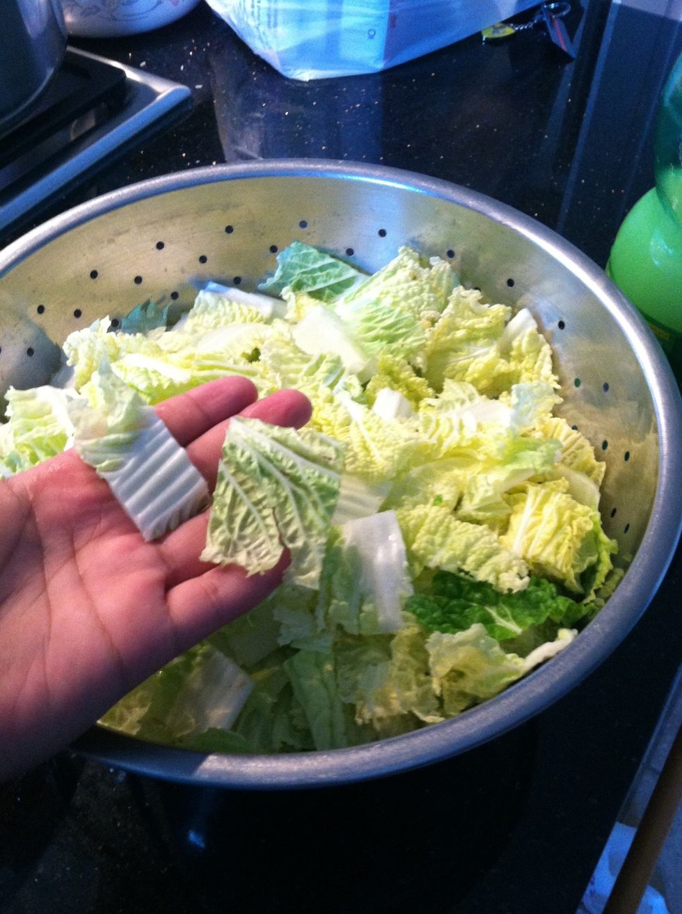 While the chicken is cooking, chop the bok Choy like this and rinse (also called "napa cabbage")