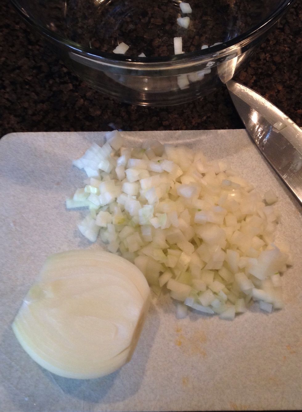 While the chicken is cooking, dice a whole Spanish onion and set aside.