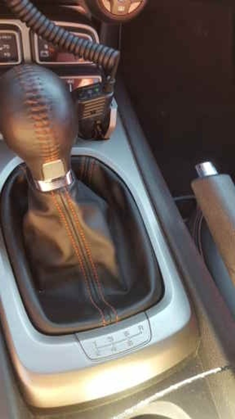 While the clutch in compressed and your handbrake is released and your foot in on the brake to keep you from rolling, move into first gear, this is all the way to the left and up.