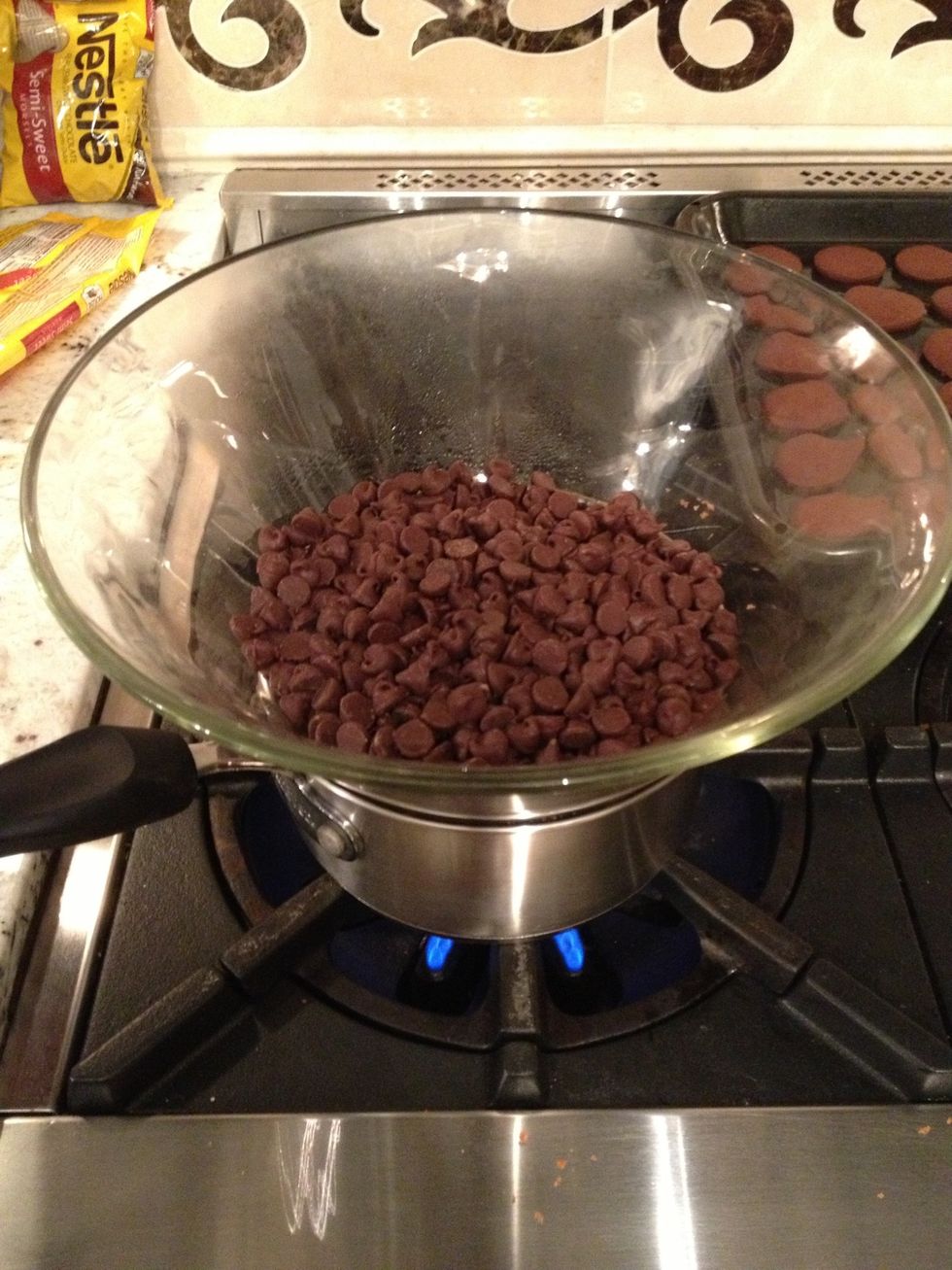 While the cookies are baking, melt your chocolate with a double boiler.