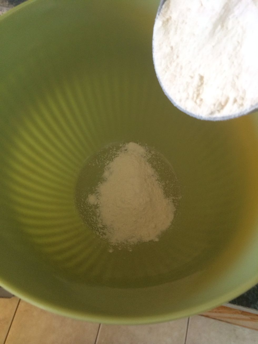 While the cornmeal is resting. Put the flour in a bowl