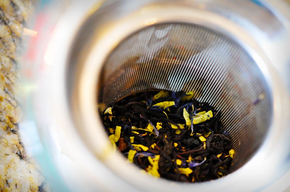 While the cream heats up, measure out 1 tbsp Hot Buttered Rum tea leaves into a tea strainer. Place the strainer in a glass measuring cup.