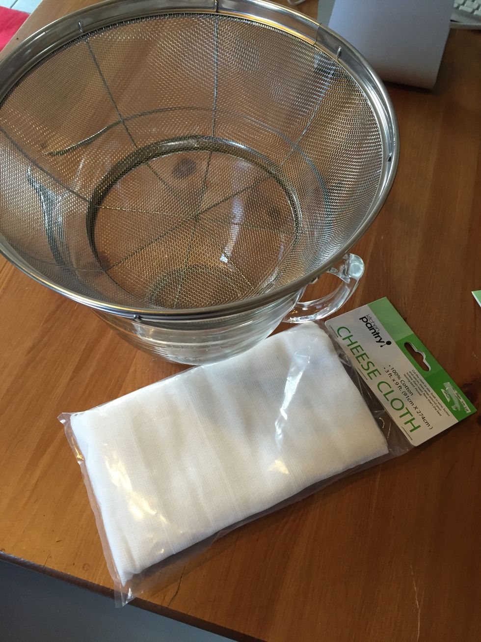While the curds are forming, get your wire strainer ready. Set it over a bowl ( or anything) that will catch the whey as it drains. Place a double layer of cheesecloth in the strainer.