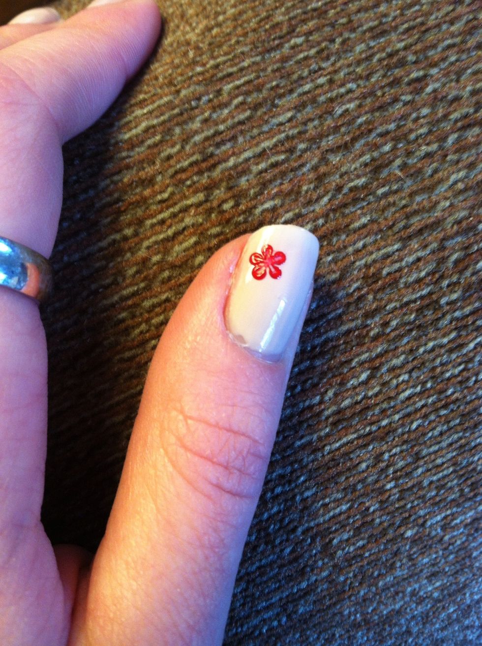 While the dots are still wet, take a toothpick and drag the wet polish towards the middle of the circle.