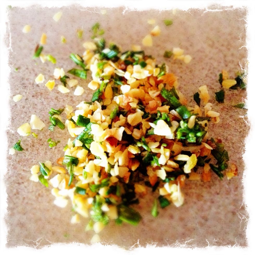 While the dutch-oven is heating up, mince the garlic and rosemary.  About a teaspoon of each.
