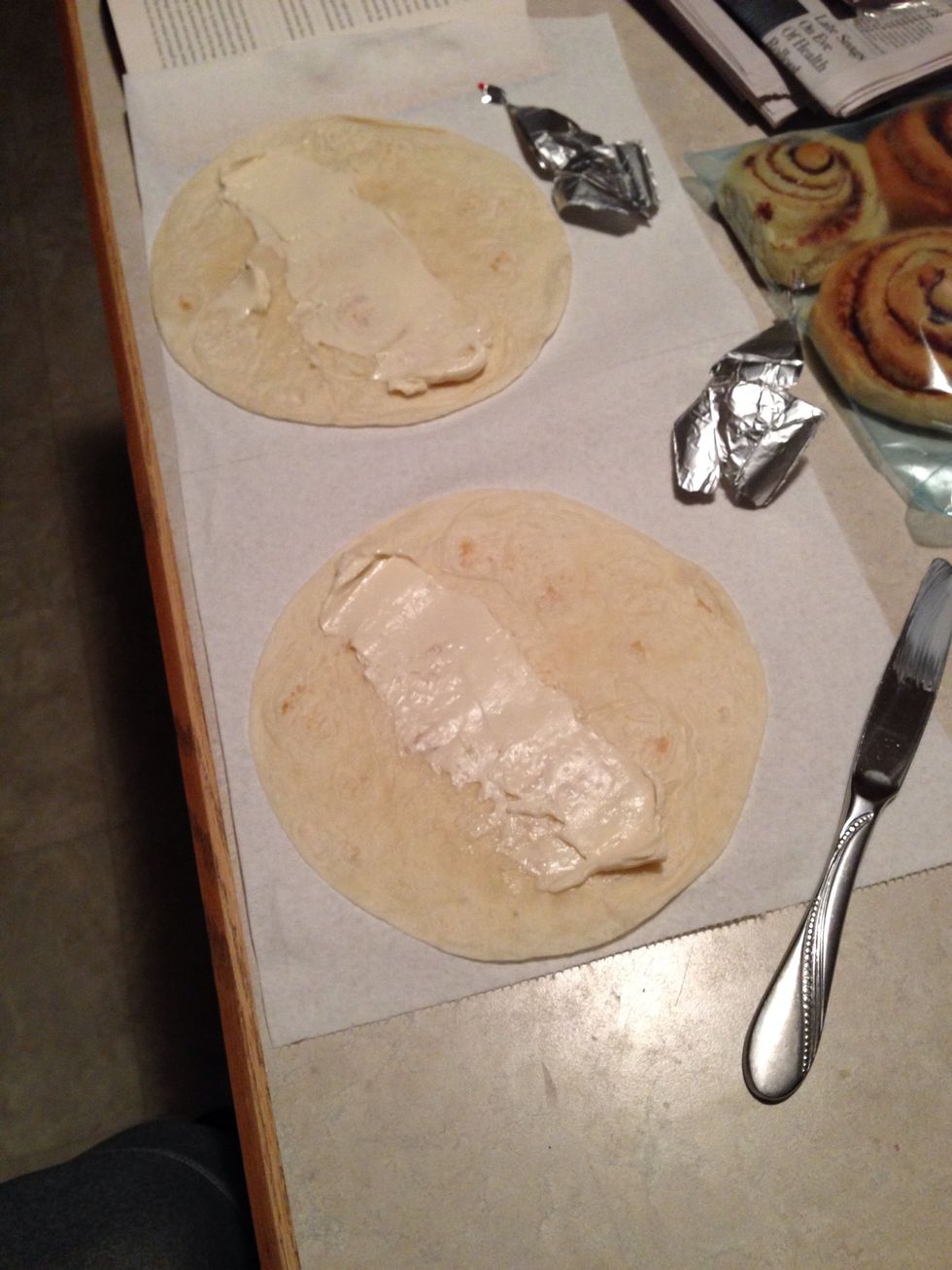 While the eggs are cooking add the cheese to your burritos