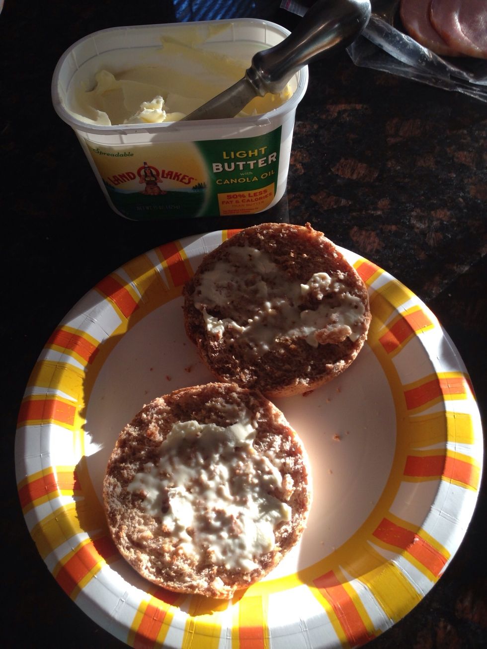 While the eggs are cooking, toast your English Muffin and butter.
