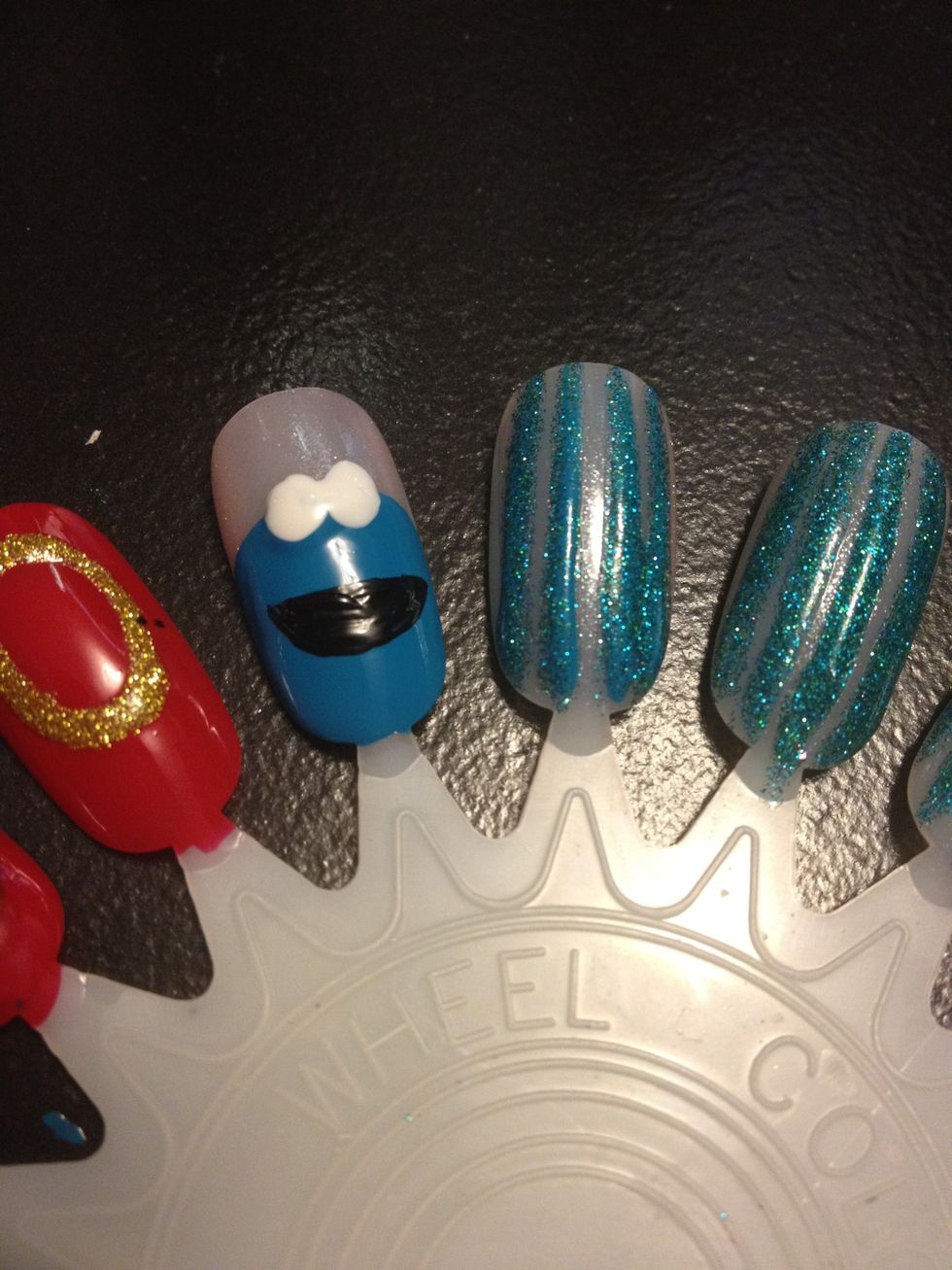 While the eyes dry do his mouth as a half circle :D