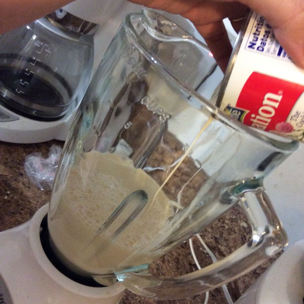 While the gelatin is settling, we wanna start with the three milk mix. I always add the sweet condensed milk first since it's the thickest. Then we add the evaporated milk and table cream and blend.