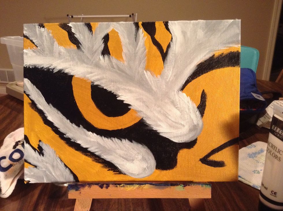While the gray is still wet, take white and blend in over the gray. Keep your brush strokes going with the grain the fur would be.