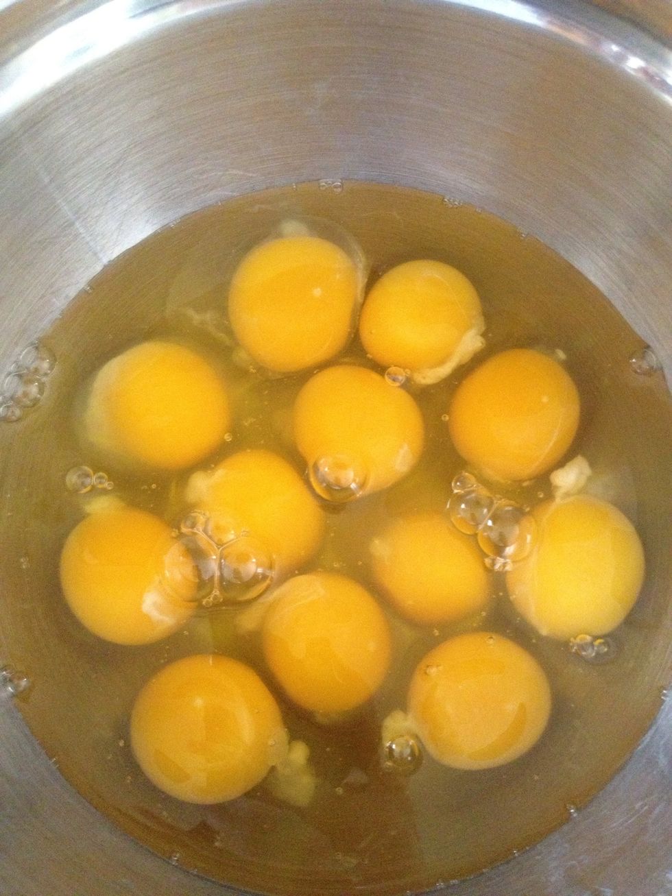 While the hash browns are cooking crack 12 large eggs into a bowl.