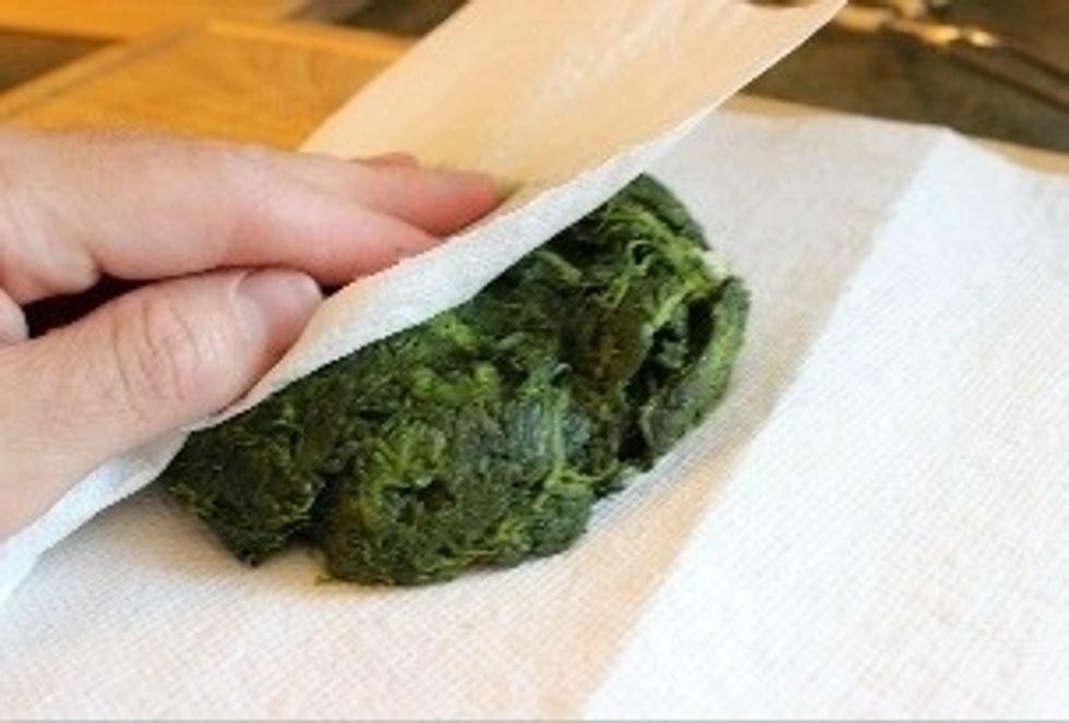While the lasagna noddles are still cooking, thaw spinach in microwave as it says on the directions. Drain & squeeze dry with a paper towel