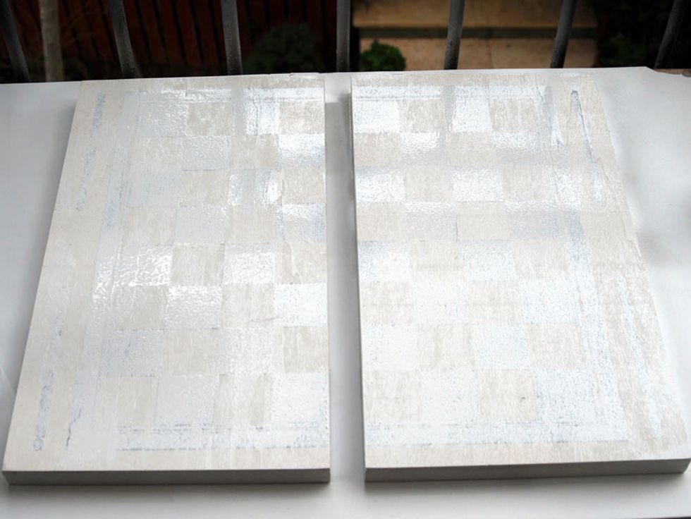 While the last layer dries, turn the boards and spray them even on the other side.