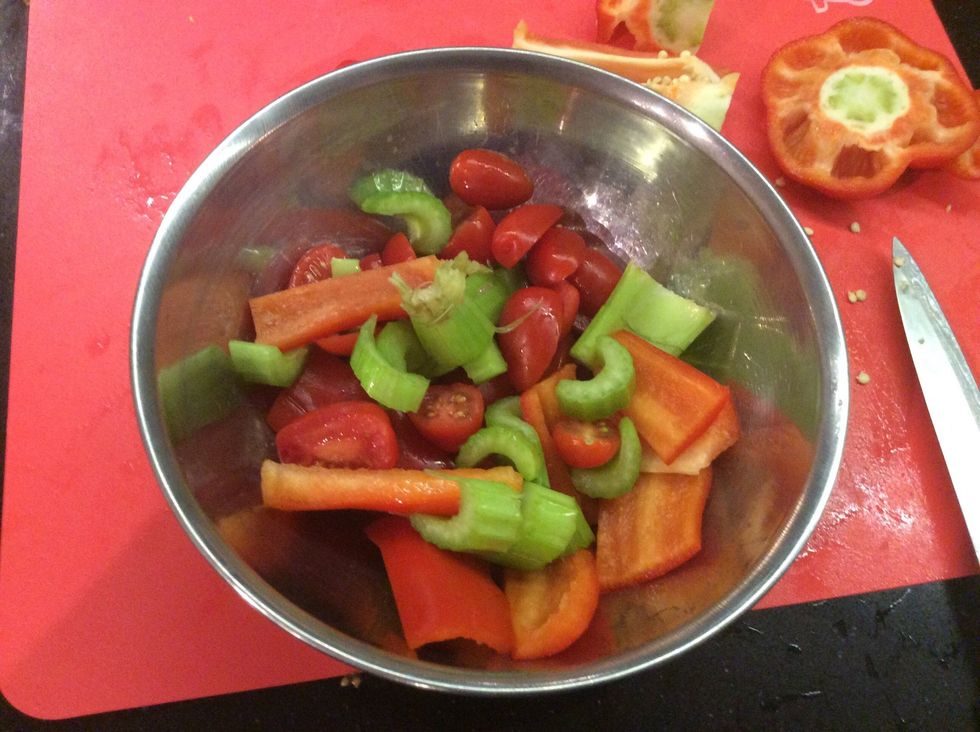 While the meat is cooking put all the salad ingredients into one bowl and put half to one cup of apple cider vinegar on top and then mix it all together