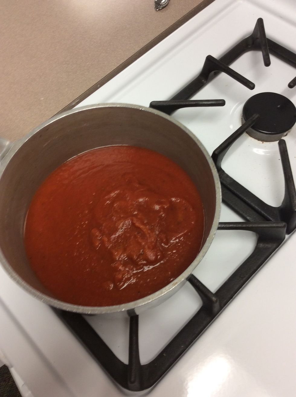 While the meatballs are cooking warm up the spaghetti sauce on medium-high