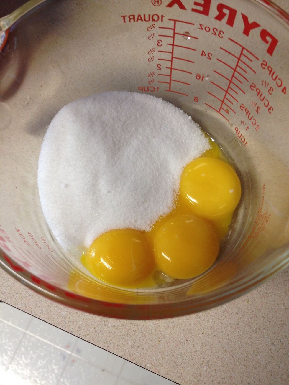 While the milk is heating up, whisk the eggs with the remaining sugar