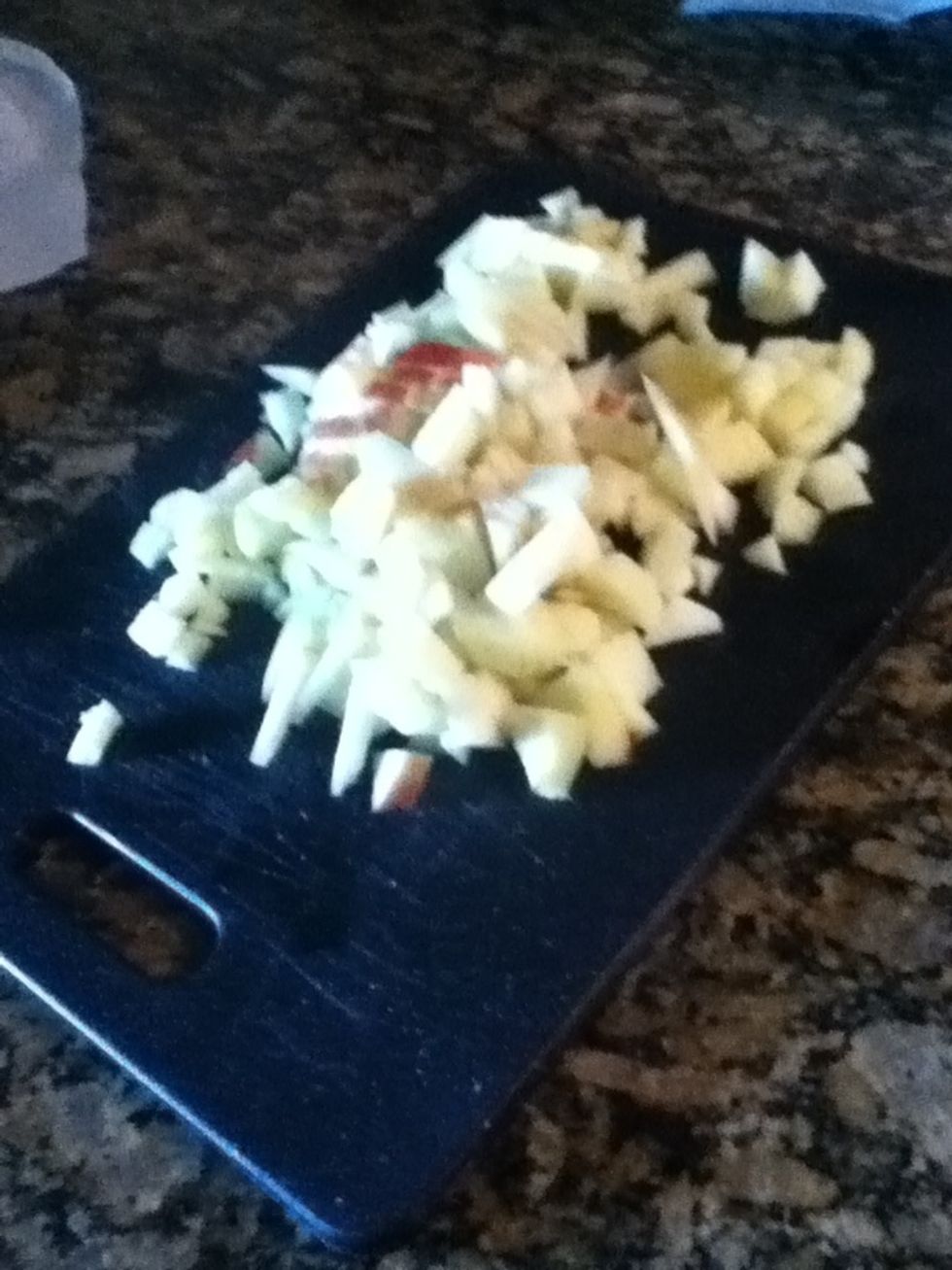 While the oatmeal simmers, remove skin from one apple and chop up both on a cutting board.