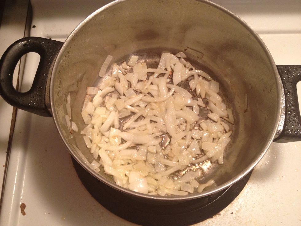 While the onion cooks into this "golden yellow" color as master chiefs in my home would say, take out the tomato an take off its skin, the hot water should make it really easy that it was in before
