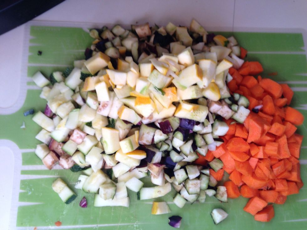 While the onion is cooking chop up the eggplant, squash, and carrots. Then add the veggies to the frying pan with the onion.