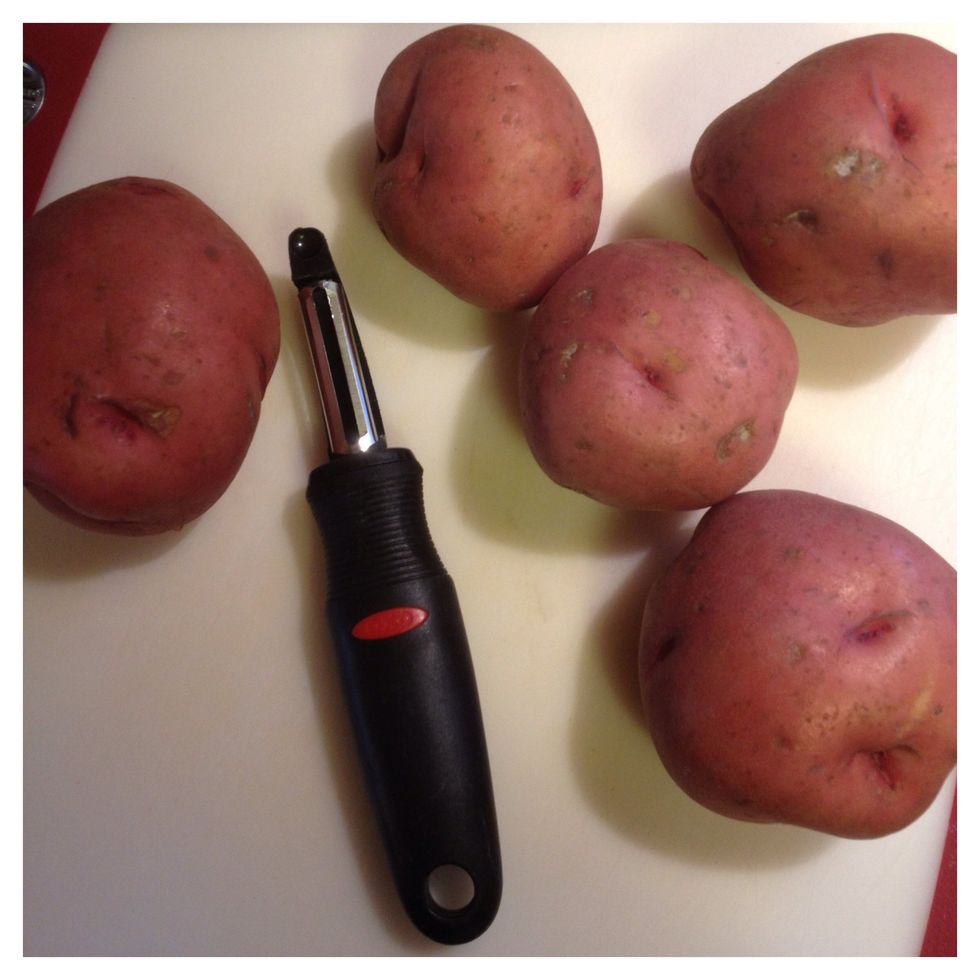 While the onions cook peel your potatoes.